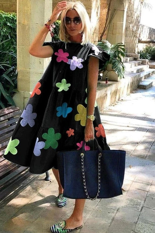 CD | Rochie fluidă cu o croială evazată și imprimeu floral mare pentru o notă sofisticată